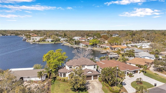 drone / aerial view with a residential view and a water view