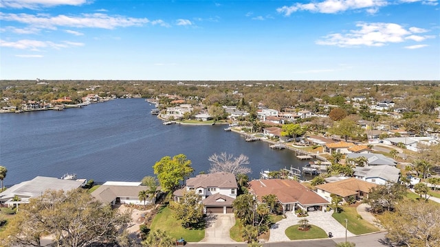 bird's eye view featuring a water view and a residential view