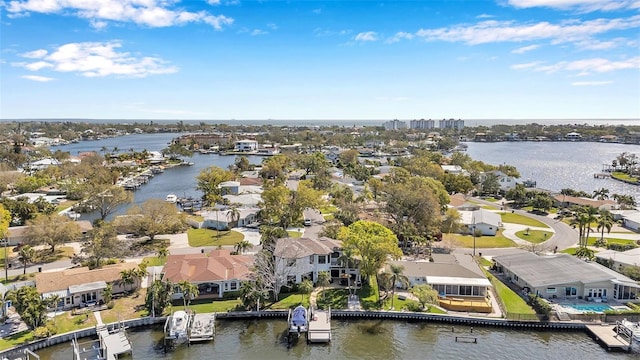 drone / aerial view featuring a water view and a residential view