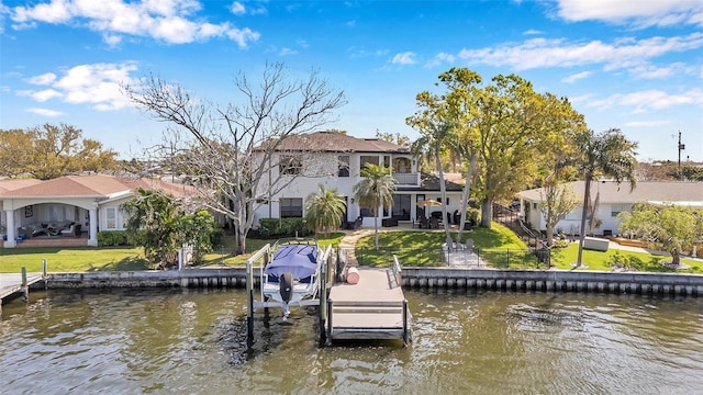 dock area with a lawn, a balcony, a residential view, a water view, and a patio area