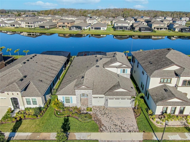 aerial view with a residential view and a water view