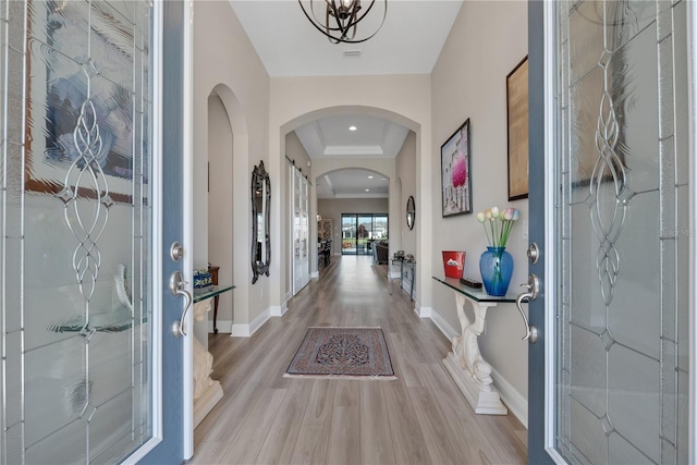 entrance foyer with light wood-style flooring, baseboards, and recessed lighting