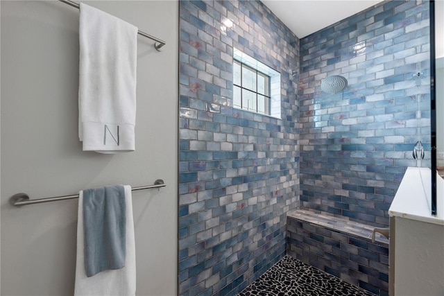 bathroom featuring tiled shower