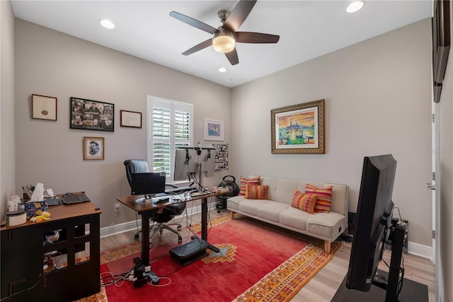 home office with light wood-style floors, recessed lighting, and baseboards