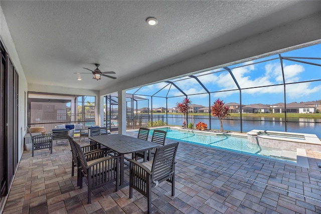 view of pool featuring a lanai, a patio area, and an outdoor living space