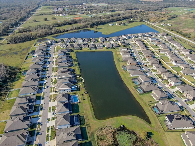 bird's eye view with a water view and a residential view