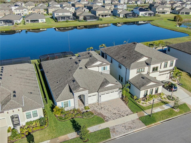 bird's eye view with a water view and a residential view