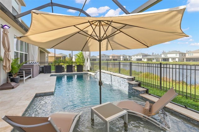 view of pool with a fenced in pool, glass enclosure, a fenced backyard, a water view, and a patio area