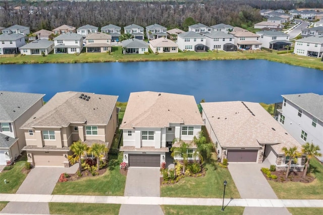 bird's eye view with a water view and a residential view