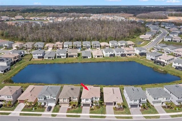 bird's eye view with a water view and a residential view