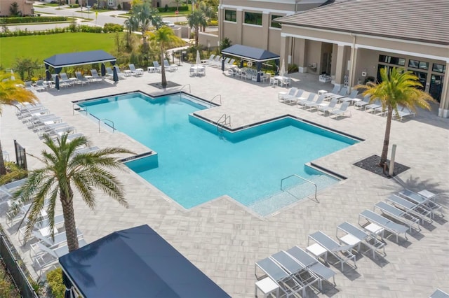 community pool featuring a gazebo and a patio area