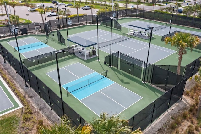 view of sport court featuring fence