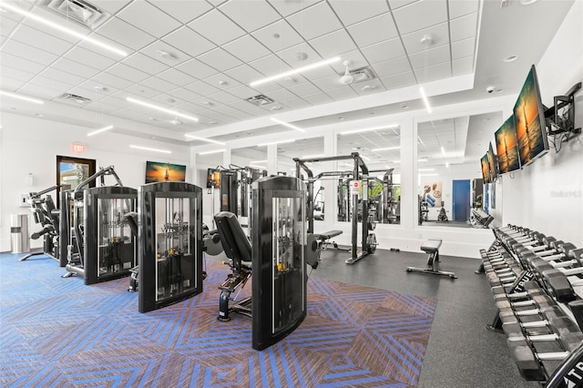 workout area with a paneled ceiling and visible vents