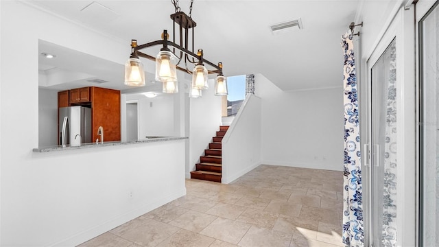 interior space with stairway, visible vents, and baseboards