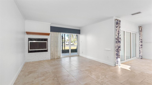 unfurnished living room with baseboards, a fireplace, ornamental molding, and visible vents