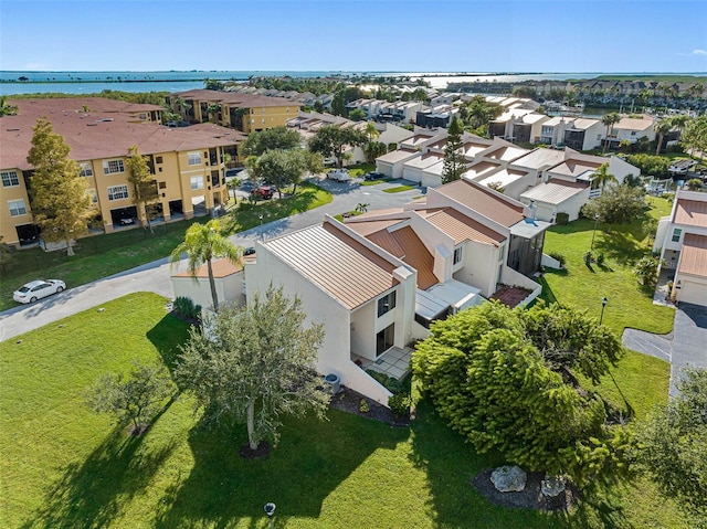 aerial view with a water view and a residential view