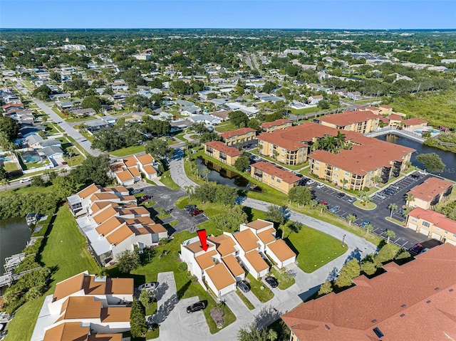 aerial view with a water view and a residential view