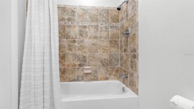 bathroom with shower / bath combination with curtain