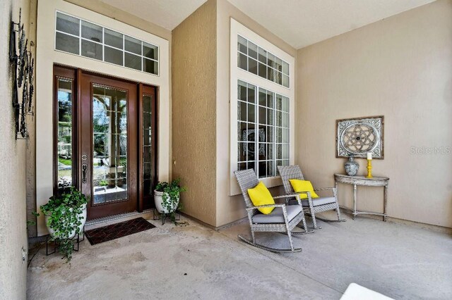 property entrance featuring stucco siding