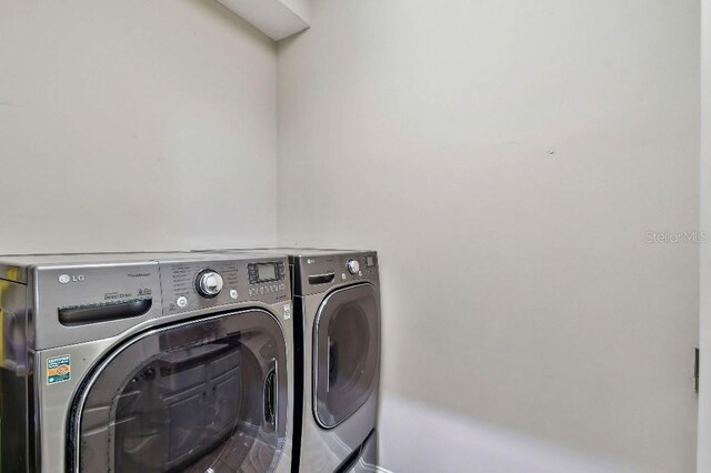 laundry area featuring laundry area and washing machine and clothes dryer