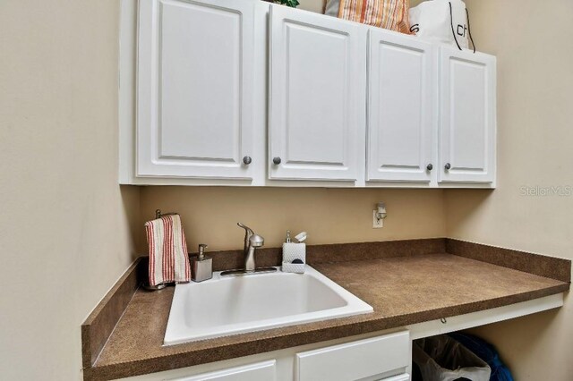 laundry area with a sink