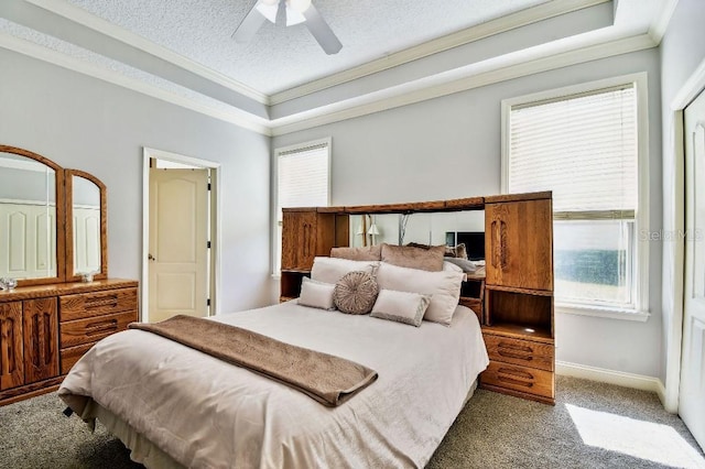 bedroom with baseboards, a textured ceiling, crown molding, and carpet