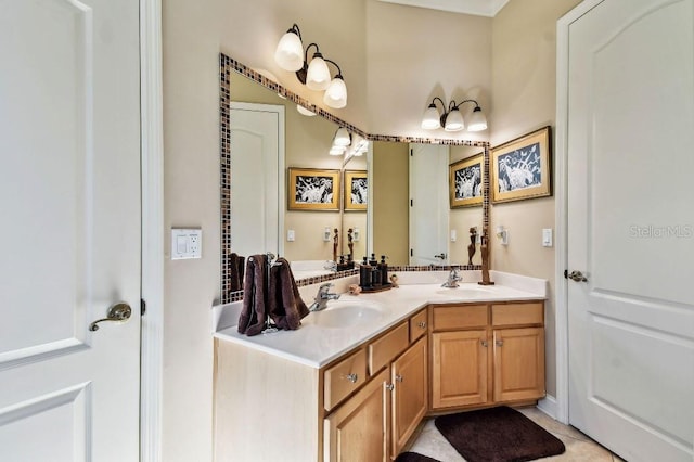 full bath with tile patterned flooring, double vanity, and a sink