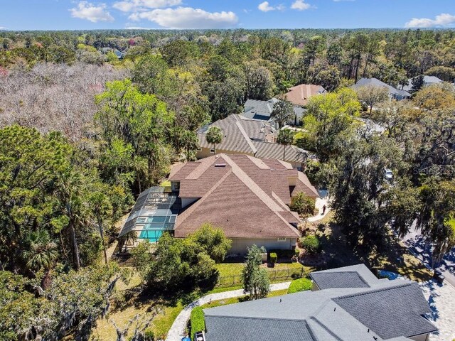 aerial view featuring a wooded view