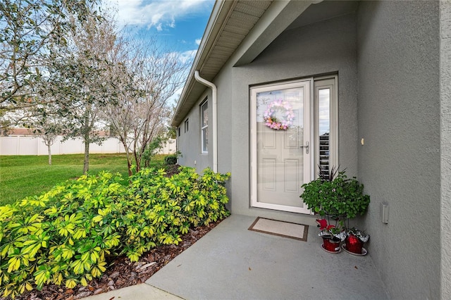 1467 Twin Villas Way, Dunedin, FL 34698 - view of exterior entry featuring stucco siding