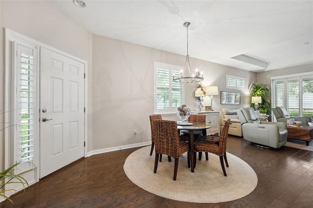 1467 Twin Villas Way, Dunedin, FL 34698 - dining room featuring dark wood-style floors, a chandelier, and baseboards