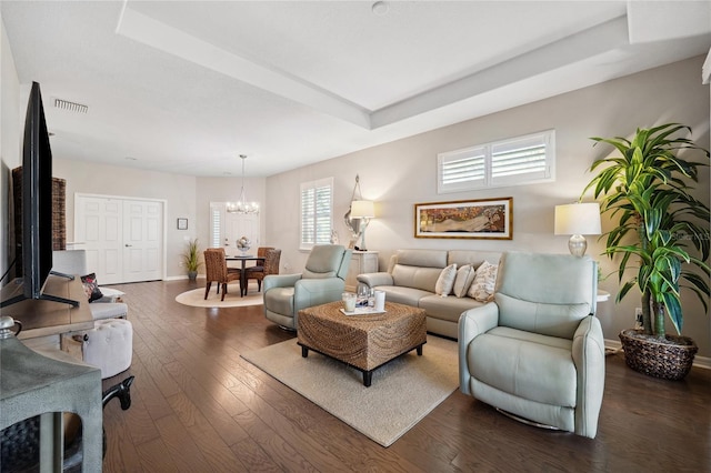 1467 Twin Villas Way, Dunedin, FL 34698 - living room featuring a chandelier, dark wood-style flooring, baseboards, and a tray ceiling