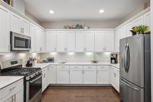 1467 Twin Villas Way, Dunedin, FL 34698 - kitchen featuring appliances with stainless steel finishes, white cabinetry, light countertops, and recessed lighting