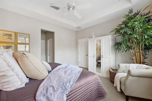 1467 Twin Villas Way, Dunedin, FL 34698 - carpeted bedroom featuring a raised ceiling and a ceiling fan