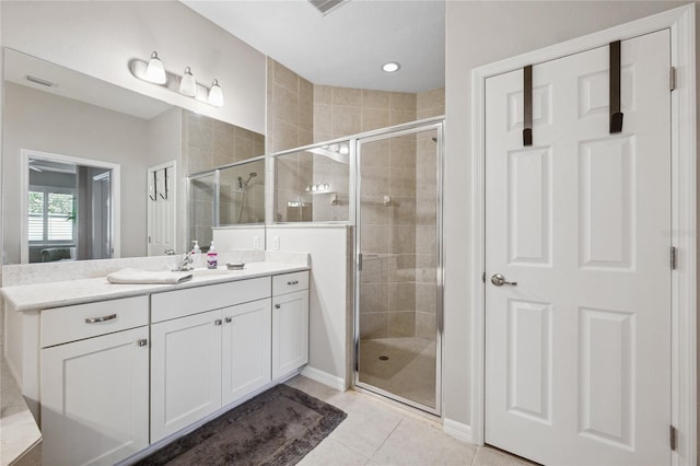 1467 Twin Villas Way, Dunedin, FL 34698 - bathroom featuring a stall shower, vanity, tile patterned floors, and recessed lighting