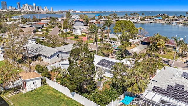 birds eye view of property featuring a water view and a city view