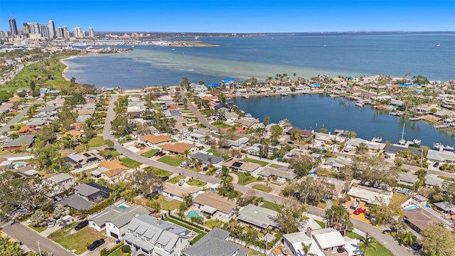 drone / aerial view featuring a residential view and a water view