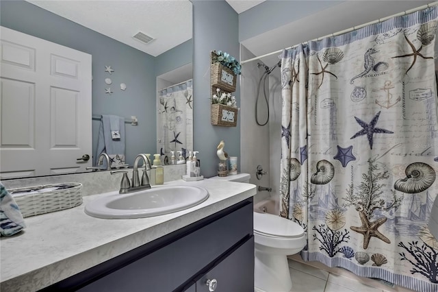 full bath with visible vents, toilet, shower / tub combo, vanity, and tile patterned floors