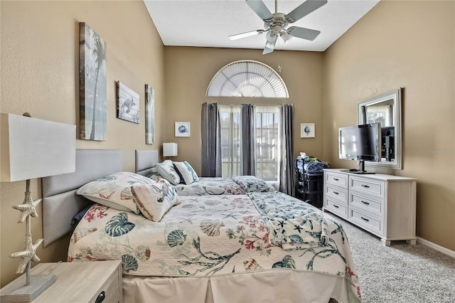 bedroom featuring ceiling fan, a textured ceiling, carpet flooring, and baseboards