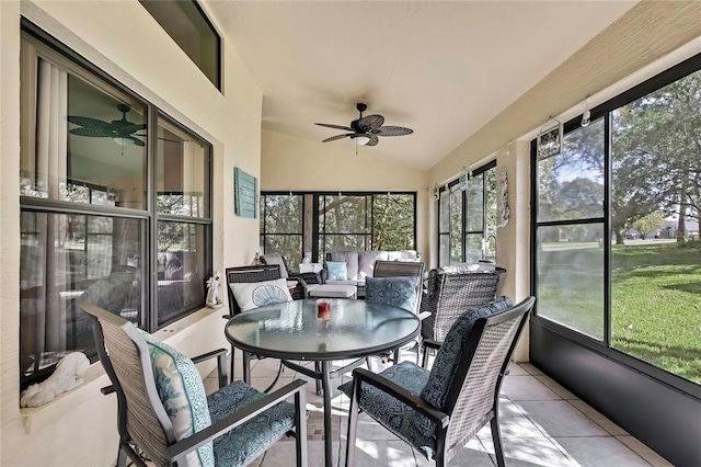 sunroom / solarium featuring vaulted ceiling and a ceiling fan