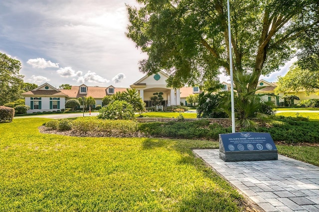 view of home's community with a lawn