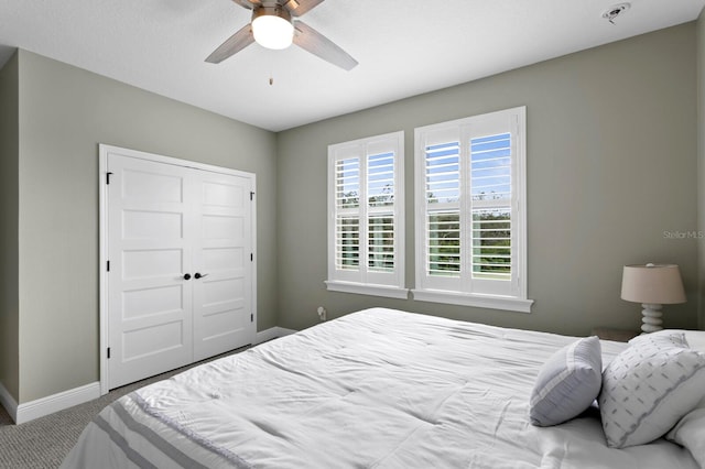 bedroom featuring carpet, a closet, ceiling fan, and baseboards