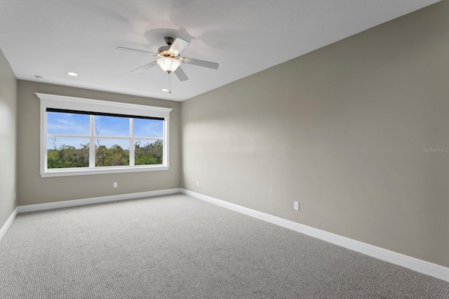 unfurnished room featuring ceiling fan, baseboards, carpet flooring, and recessed lighting