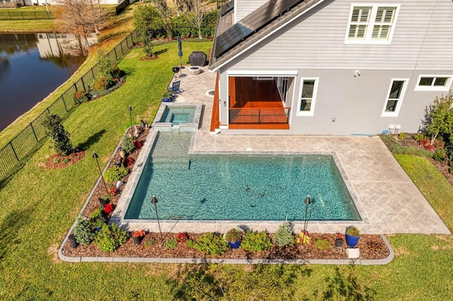 view of swimming pool with a fenced in pool, a fenced backyard, a water view, a yard, and a patio area