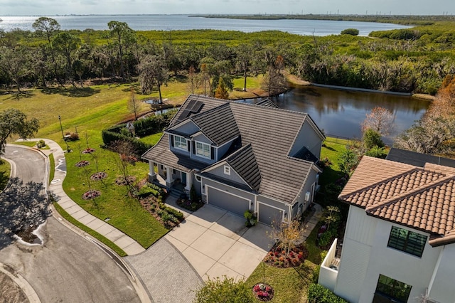 drone / aerial view with a water view