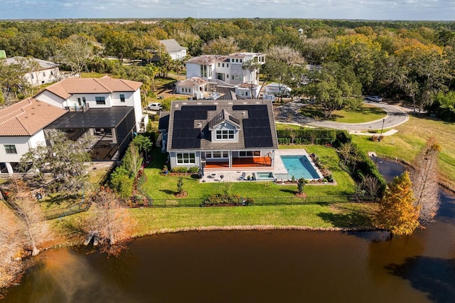 aerial view with a water view, a residential view, and a view of trees