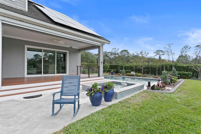 view of patio / terrace with a fenced in pool and a ceiling fan