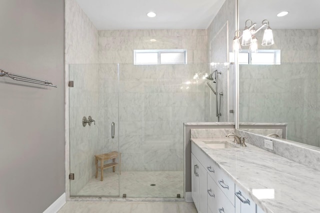 full bath with recessed lighting, baseboards, a shower stall, and vanity