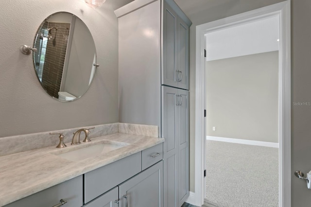 bathroom with vanity and baseboards