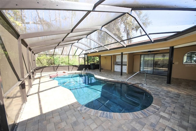 outdoor pool with a patio and a lanai