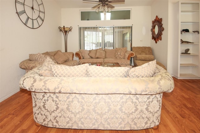 living room with ceiling fan and wood finished floors